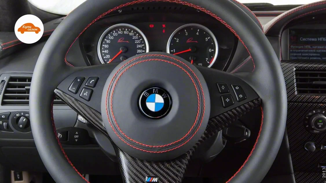 BMW 650 — Перетяжка руля черной кожей с красной строчкой и карбоновыми вставками для BMW