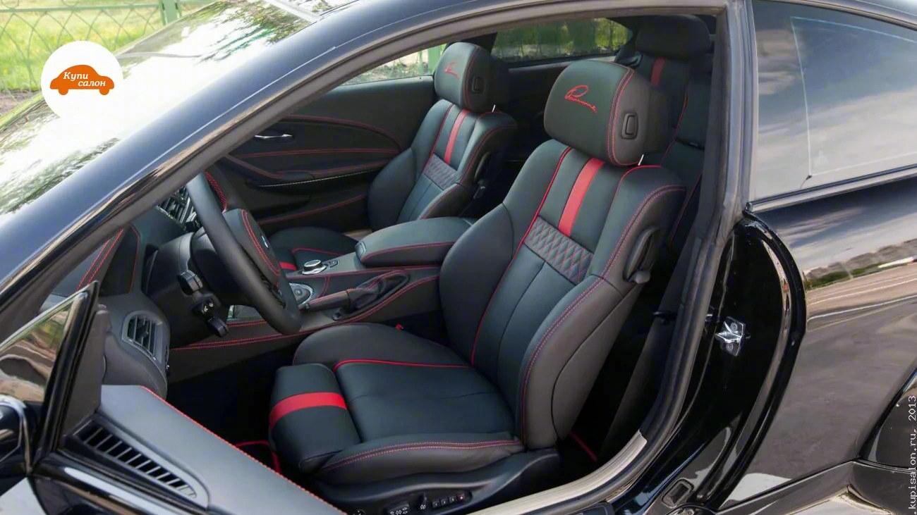 BMW 650 — Перетяжка салона черной кожей с красными акцентами и вышивкой на подголовниках