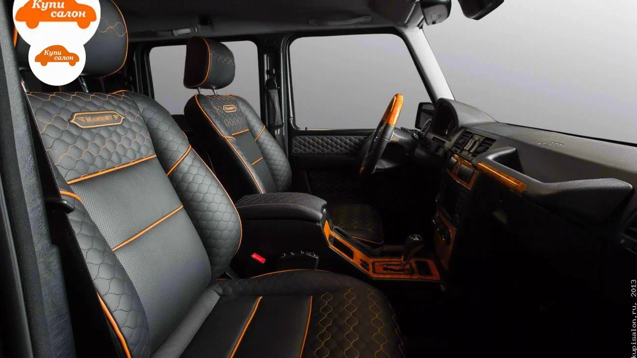 Mercedes-Benz G — Перетяжка салона Mercedes-Benz G-класса в черную кожу с оранжевыми акцентами и сотами