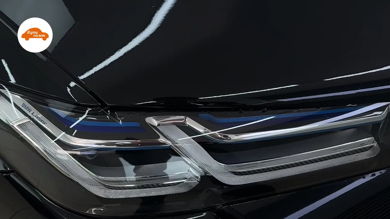 Оклейка защитной пленкой капота и фар черного BMW Laser. Глянцевая поверхность.