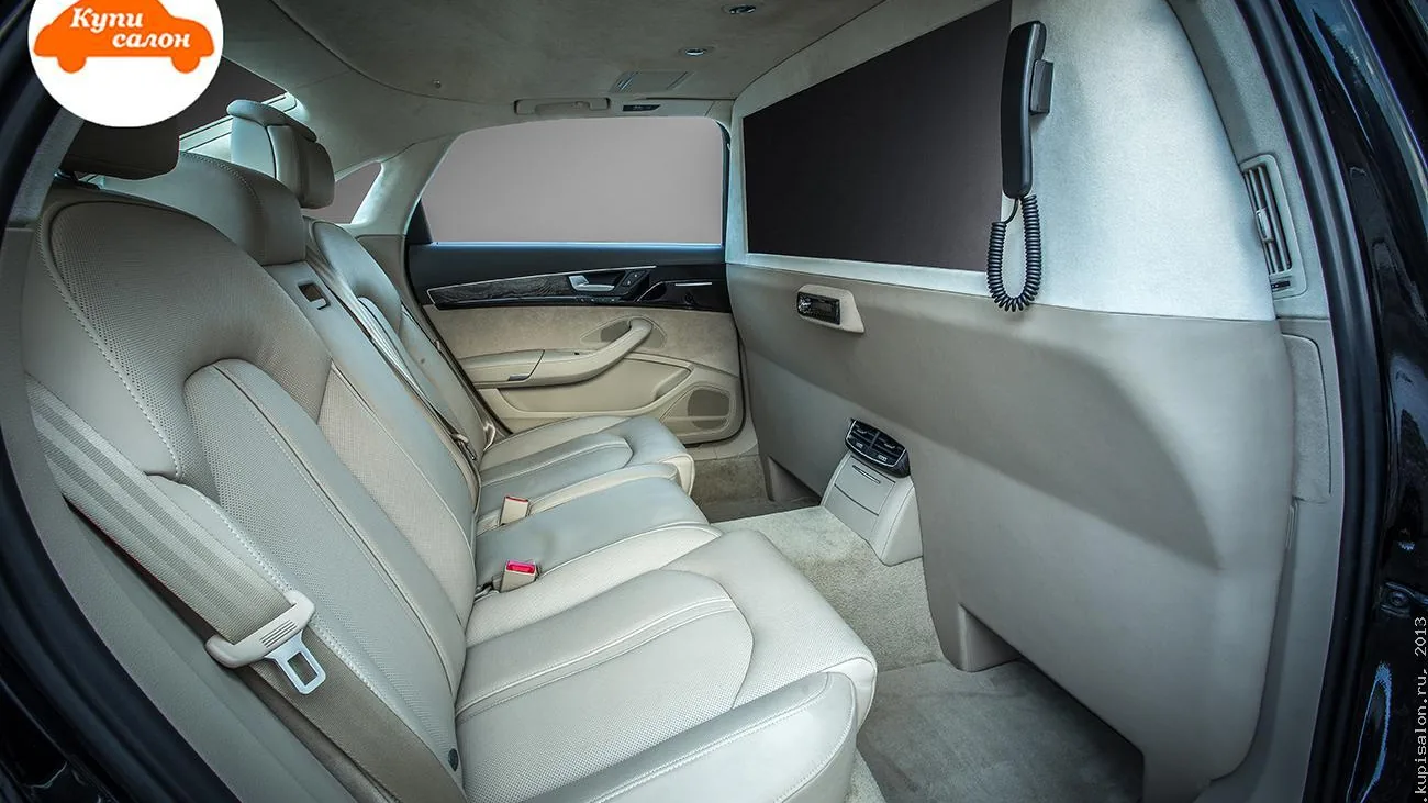 Перетяжка заднего ряда сидений и потолка Audi A8 светлой кожей с перфорацией