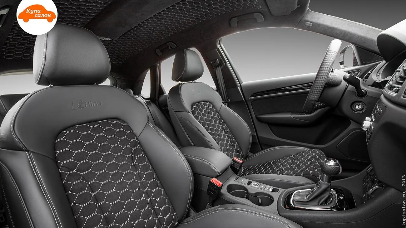 Перетяжка салона Audi Q3 S Line черной кожей и алькантарой с сотовой перфорацией и белой строчкой