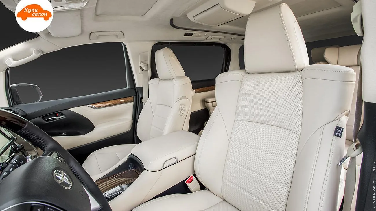 Перетяжка салона Toyota Alphard, светлая кожа с перфорацией, руль с деревянными вставками