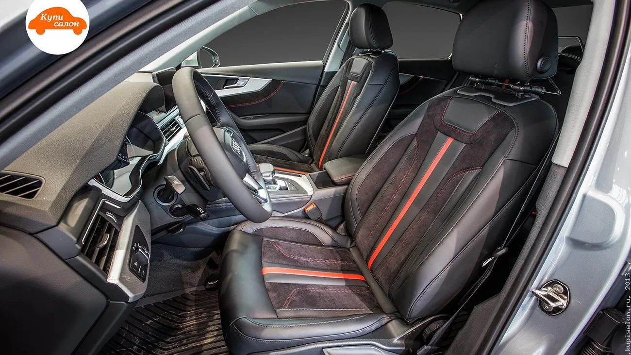 Перетяжка салона Audi: сиденья, руль, центральный подлокотник и дверные вставки из черной кожи и алькантары с красной строчкой