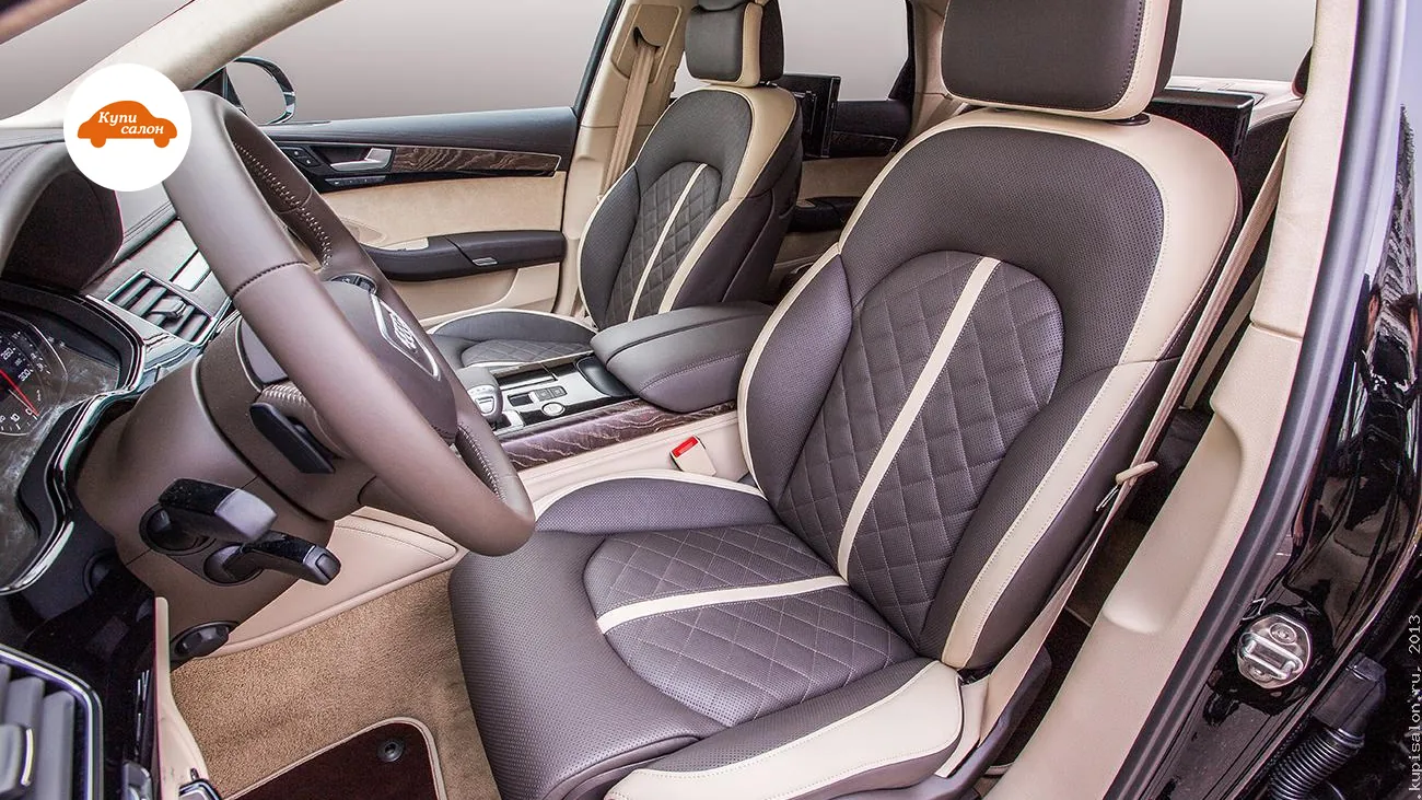 Перетяжка салона Audi A8: сиденья, руль, подлокотник, дверные вставки из коричневой кожи с бежевыми акцентами, ромбовидной строчкой и перфорацией