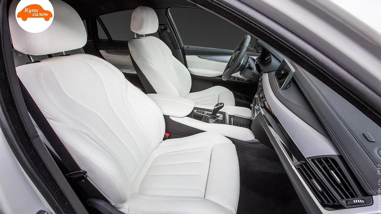 Перетяжка салона BMW X6 белой перфорированной кожей
