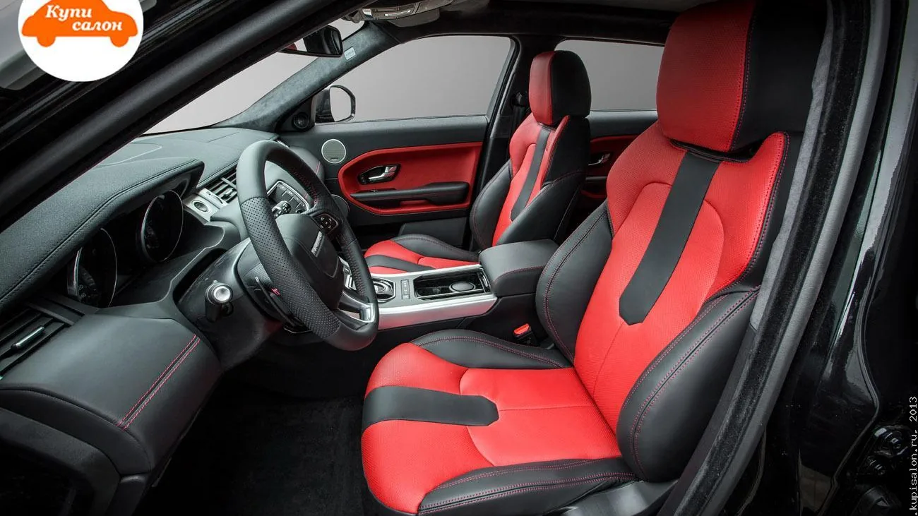 Перетяжка салона Range Rover Evoque: сиденья и дверные карты в красно-черной коже с красной строчкой.