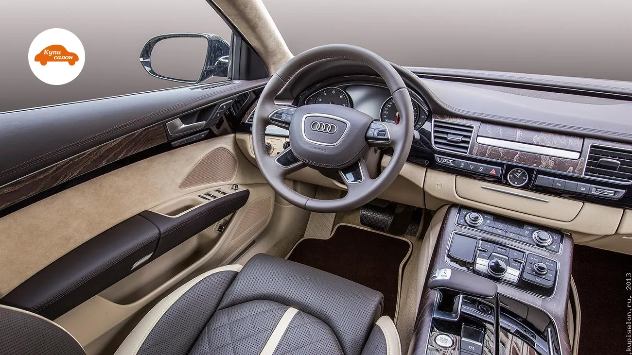 Перетяжка салона Audi A8. Коричневая кожа, бежевая алькантара, перфорация, декоративная строчка.