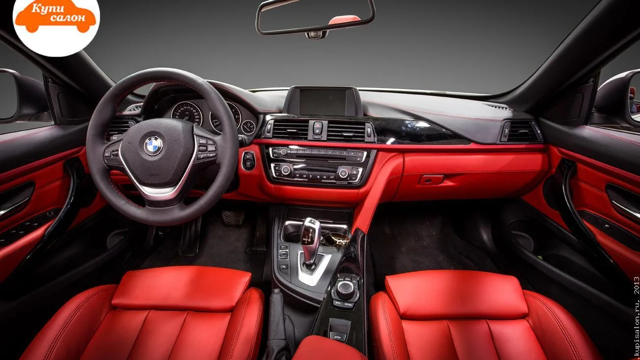 Перетяжка салона BMW в красную кожу с черными элементами и красной строчкой