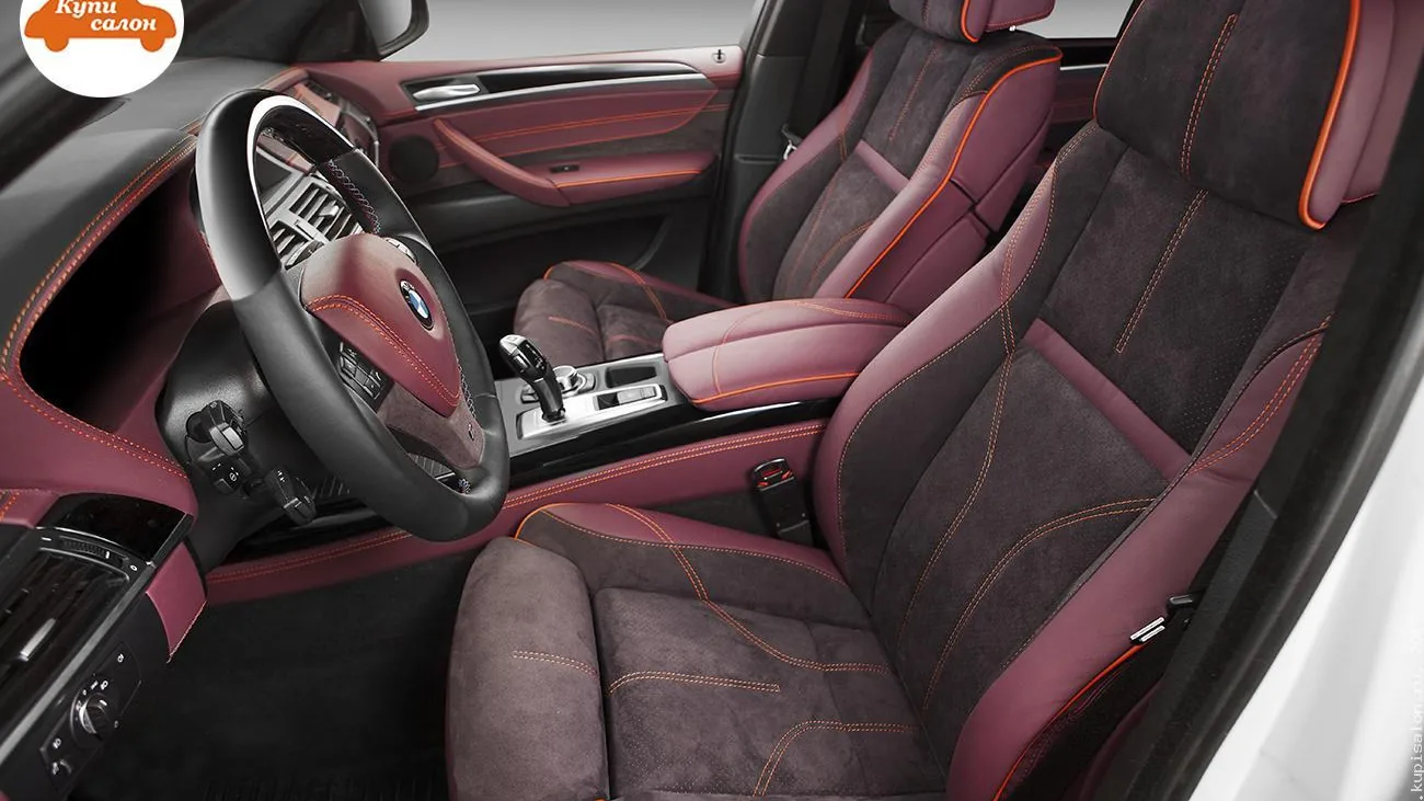 Перетяжка салона BMW X5: сиденья, руль, дверные карты, торпедо в бордовой коже и алькантаре с оранжевой строчкой