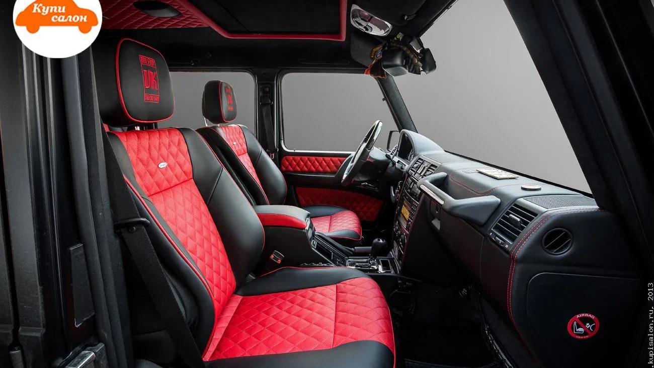 Перетяжка салона Mercedes-Benz G-Class в красно-черную кожу с ромбовидной прострочкой и вышивкой на подголовниках.