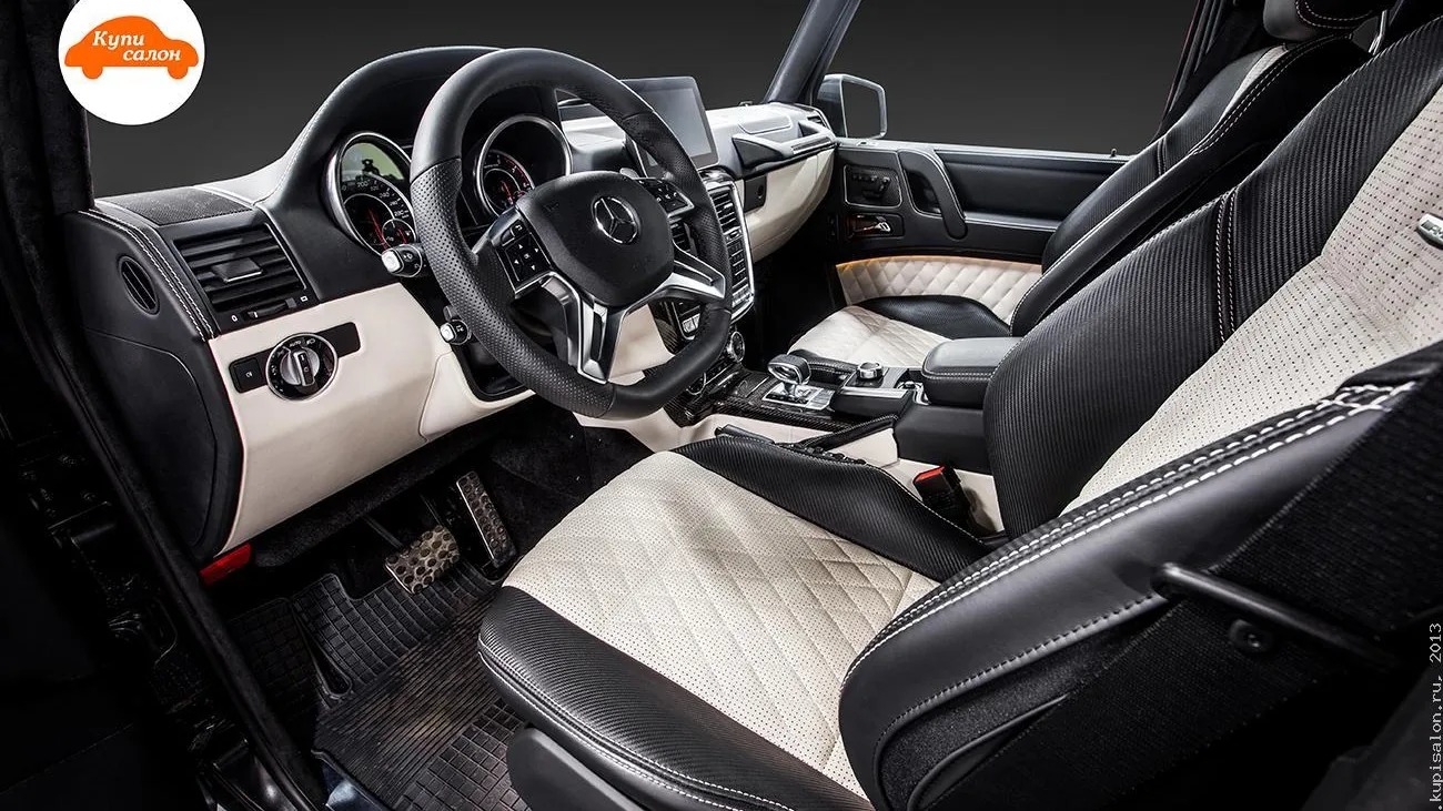 Перетяжка салона Mercedes-Benz G-Class: сиденья, руль, торпедо, двери, консоль в бежевой коже, карбоне
