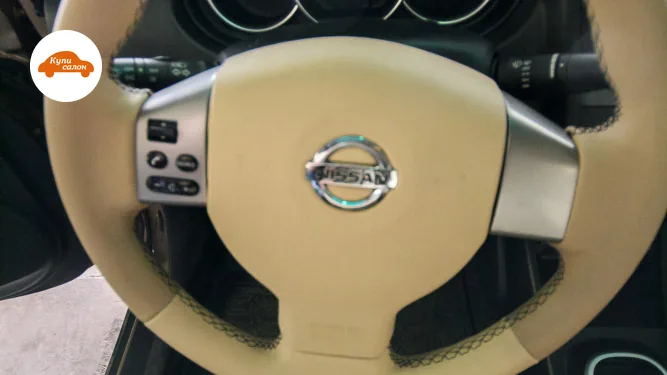 Перетяжка руля Nissan в бежевую экокожу с черной строчкой