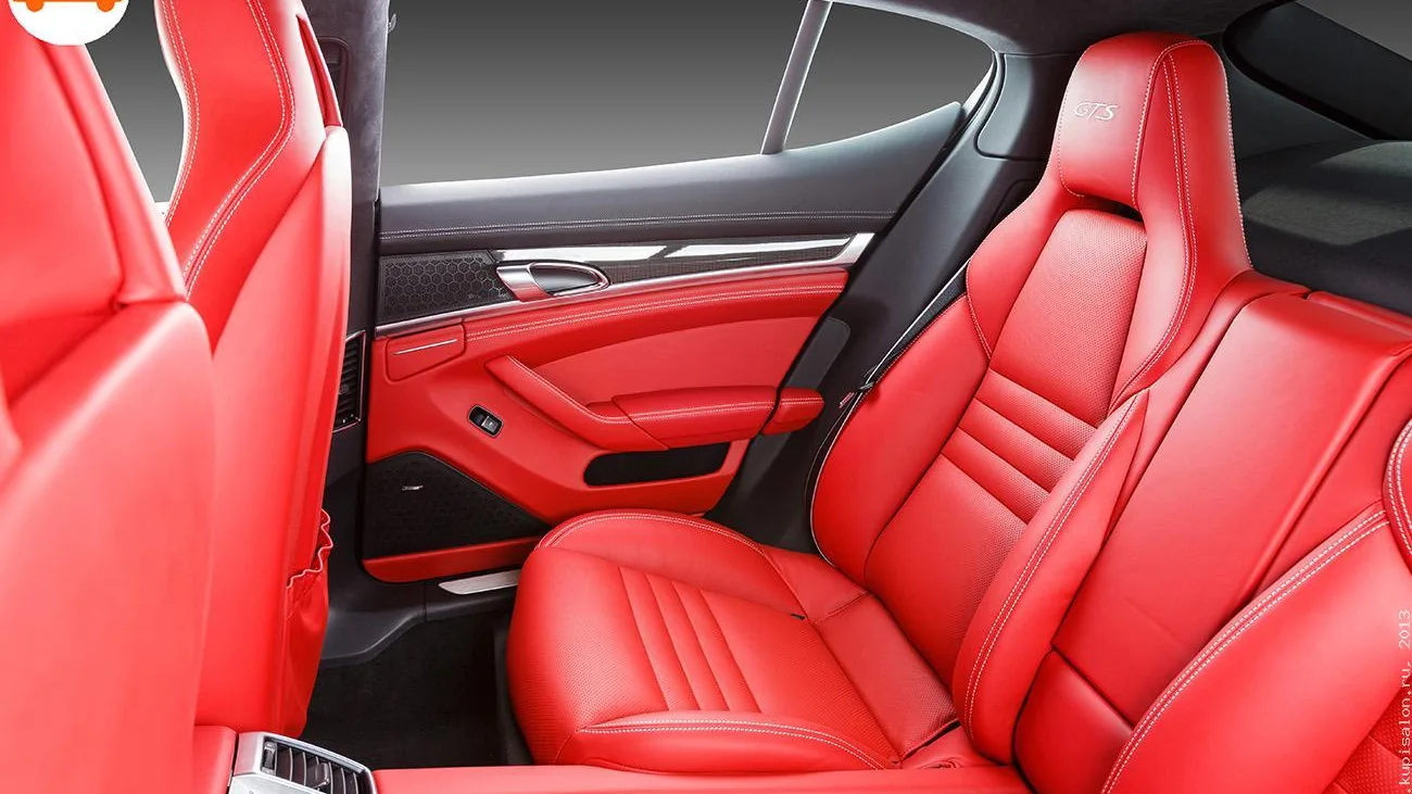 Перетяжка салона Porsche Panamera GTS красной кожей с белой строчкой и карбоновыми вставками